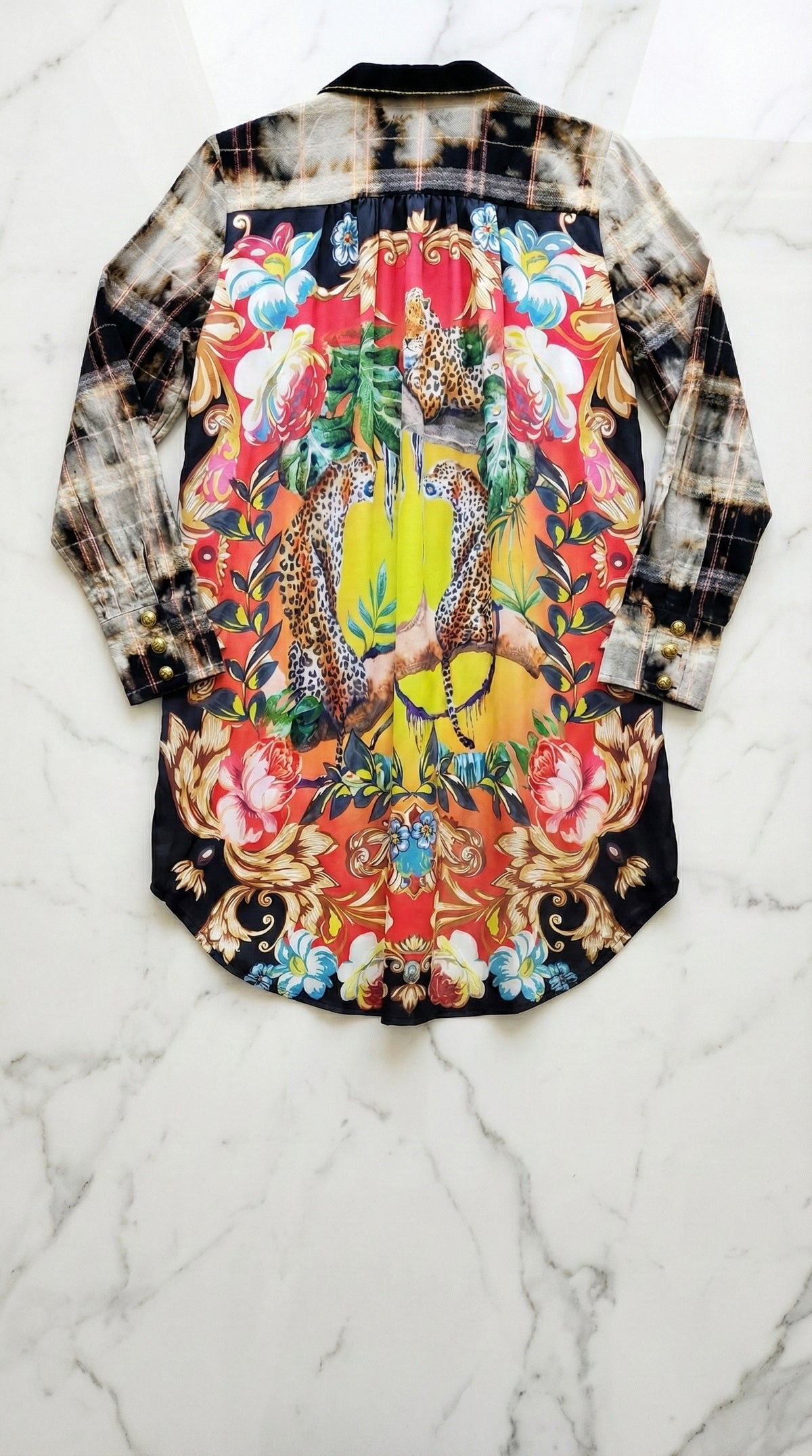 Back of the collage-print shirt dress laid flat, showing a colorful crown graphic.